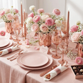 Rose gold pre-rolled plastic cutlery set on a romantic Valentine's Day tablescape with blush pink plates and pink florals