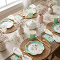 Floral tea party table setting for 25 — overhead flat-lay with floral paper cups, plates, gold cutlery, linen napkins and flowers