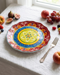 Floral Art ceramic dinner plate with botanical pattern styled with seasonal fruit and silver fork