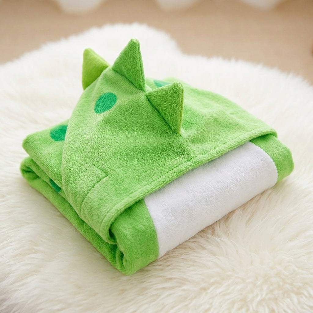 DinoSplash hooded towel product shot showing vibrant green color and dinosaur design detail