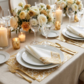 Colorful gold-printed paper napkins and placemats styled in a festive table place setting with gold cutlery and floral centerpiece