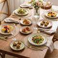 Colorful medallion ceramic disc plates styled on a dining table with food and gold cutlery
