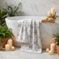 Soft Floral Jacquard Bath Towels draped in a luxurious spa bathroom