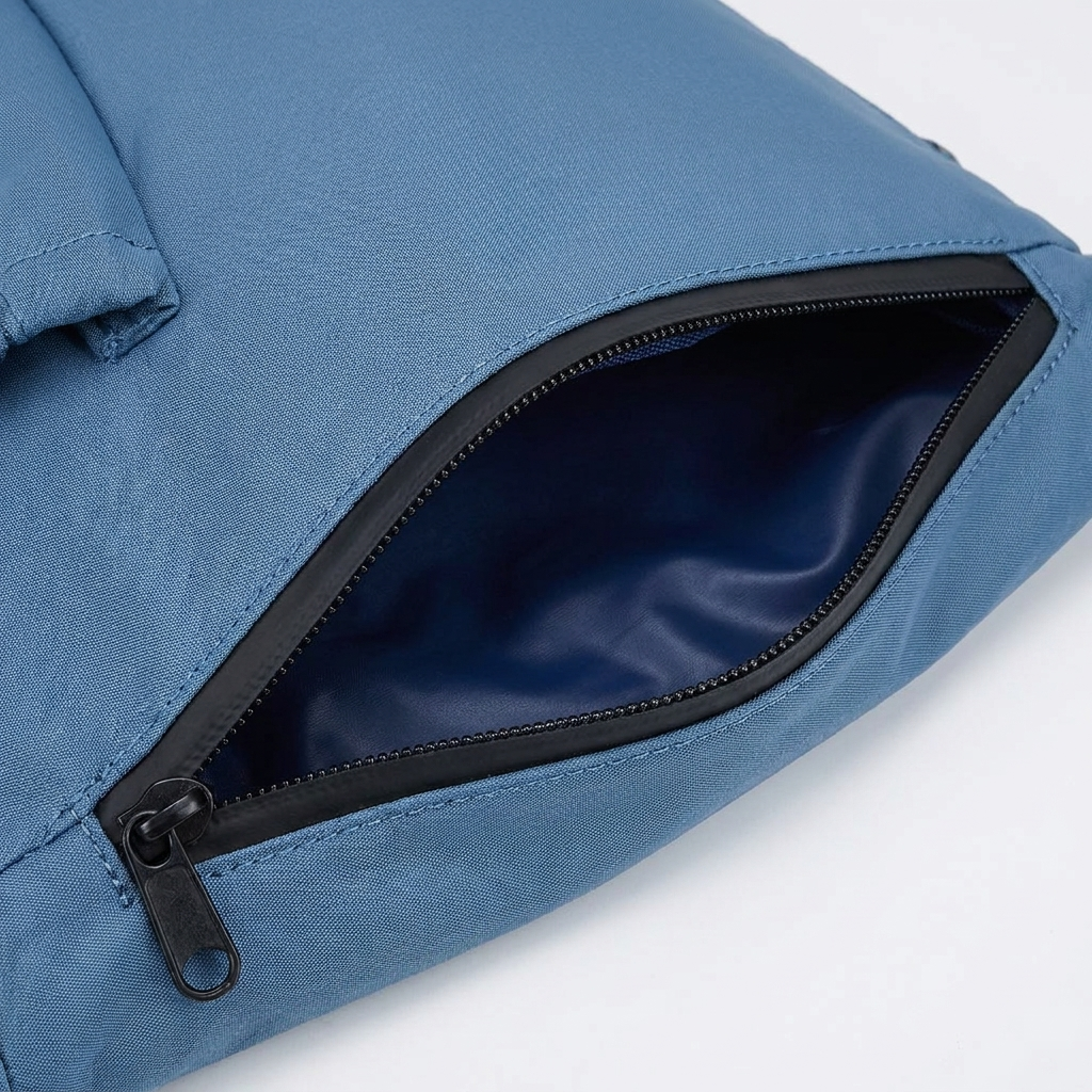 Close-up of waterproof zip wet pocket on bottom of yoga carrier bag showing zipper and lining