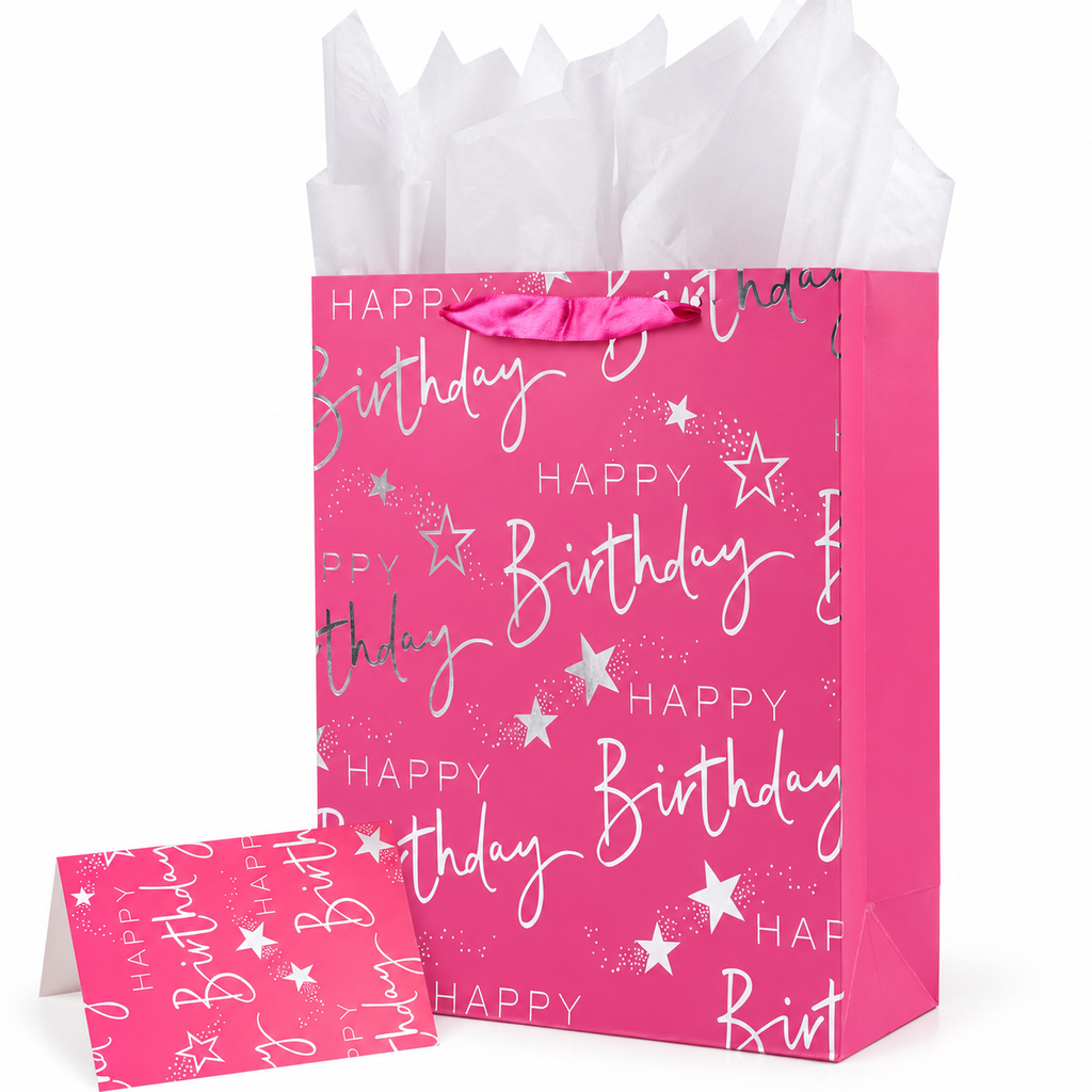 Pink 12.6-inch birthday gift bag with silver HAPPY Birthday print, white tissue and matching greeting card on white.