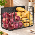 One black wire storage basket with an open U-shaped front, supported on a counter. Onions, potatoes and kitchen decor are props, not included.