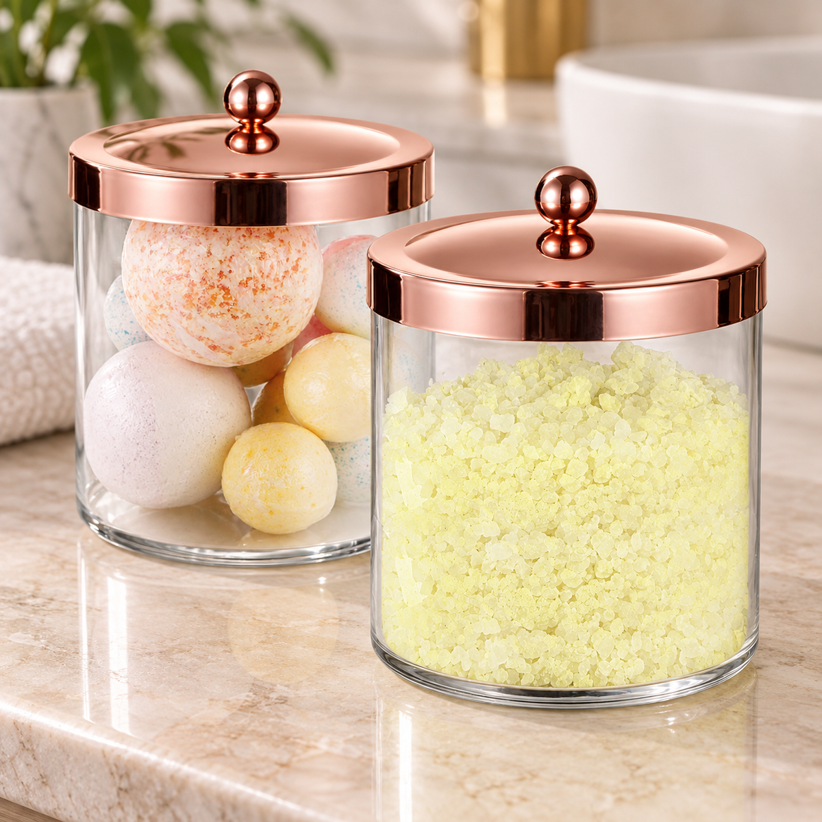 Independent close view of two closed rose-gold lids and ball knobs; bath contents and bathroom setting are styling props, not included.