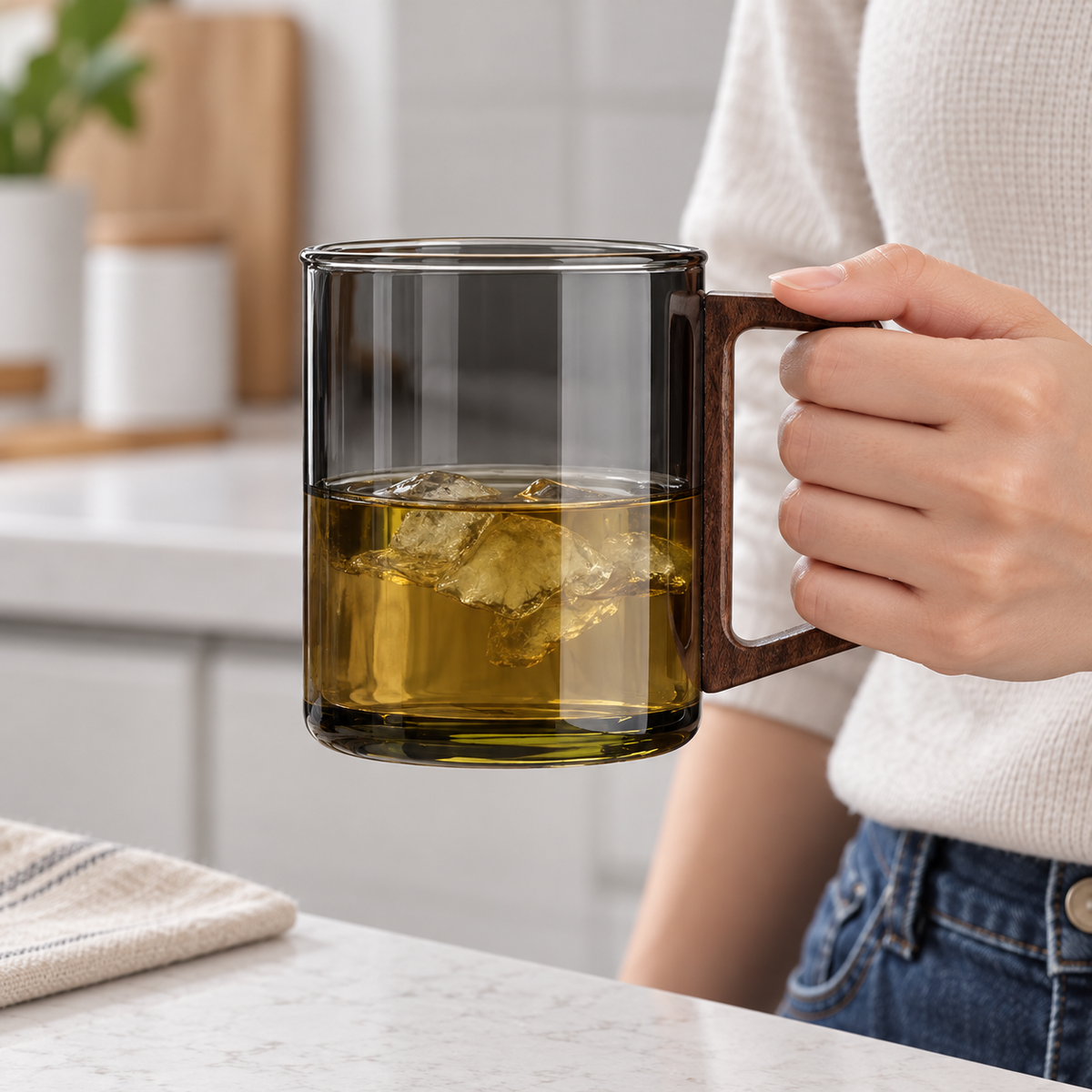 Smoky Gray Style 400 ml cup held for scale, with iced tea. Styling beverage is not included.