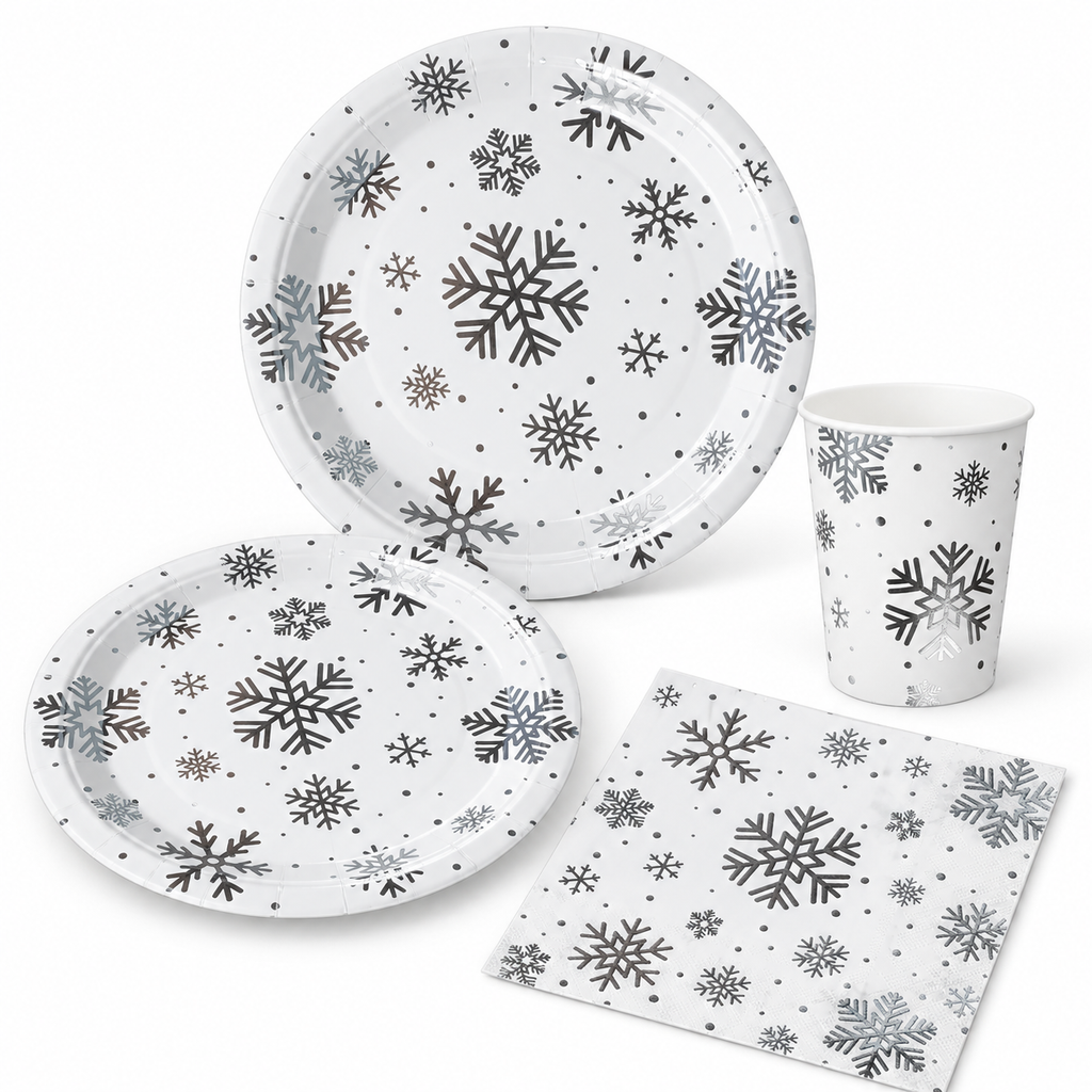 White-background sample of the silver snowflake paper tableware: two plate sizes, tapered cup and square napkin.