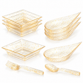 White-background sample assortment of clear gold-flecked square and teardrop mini dishes with matching miniature fork and spoon.