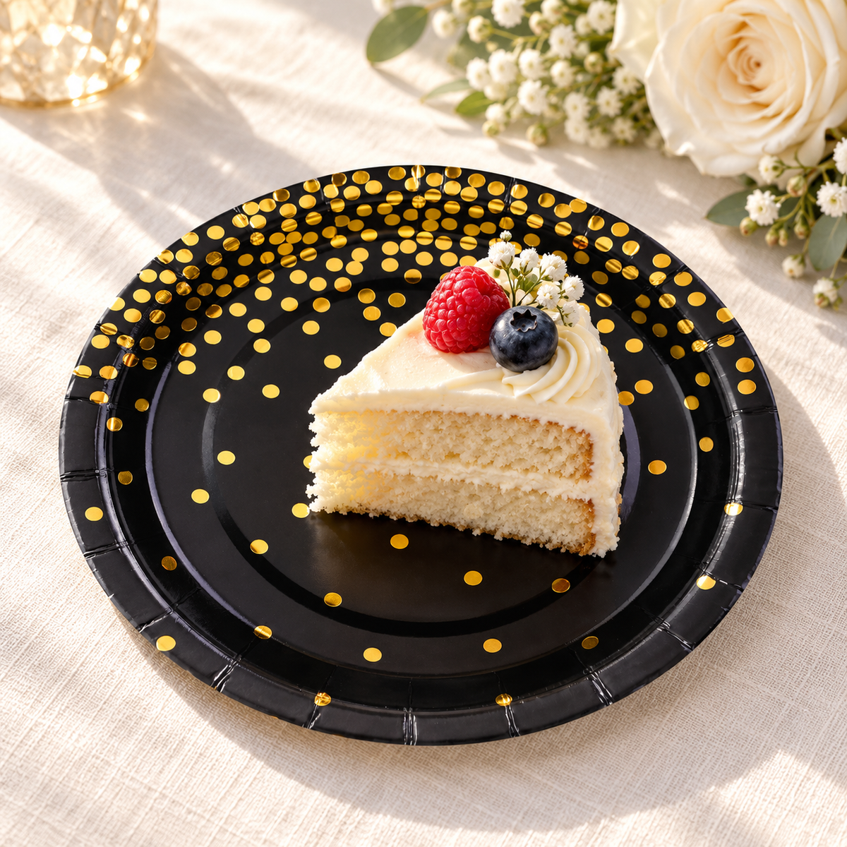 Black and gold dot paper plates used for cake service. Food, tableware and decor are styling props, not included.