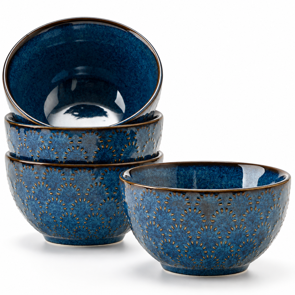 Set of four embossed blue porcelain bowls on a white background