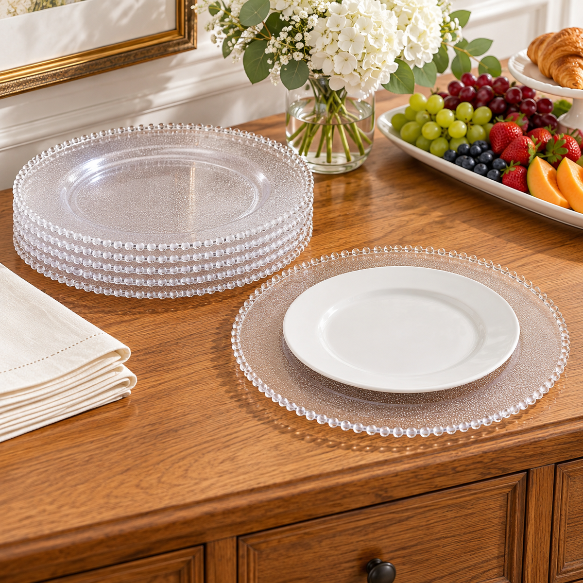 Beaded Clear Charger Plates, 50 pc in a styled product photograph. Dinner plates, food, flowers and extra decor are styling props, not included.