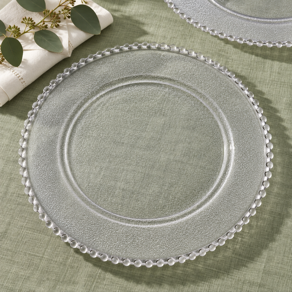 Beaded Clear Charger Plates, 50 pc in a styled product photograph. Dinner plates, food, flowers and extra decor are styling props, not included.