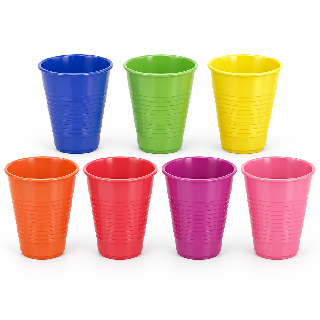 Seven colors of tapered ribbed plastic party cups against a clean white background.