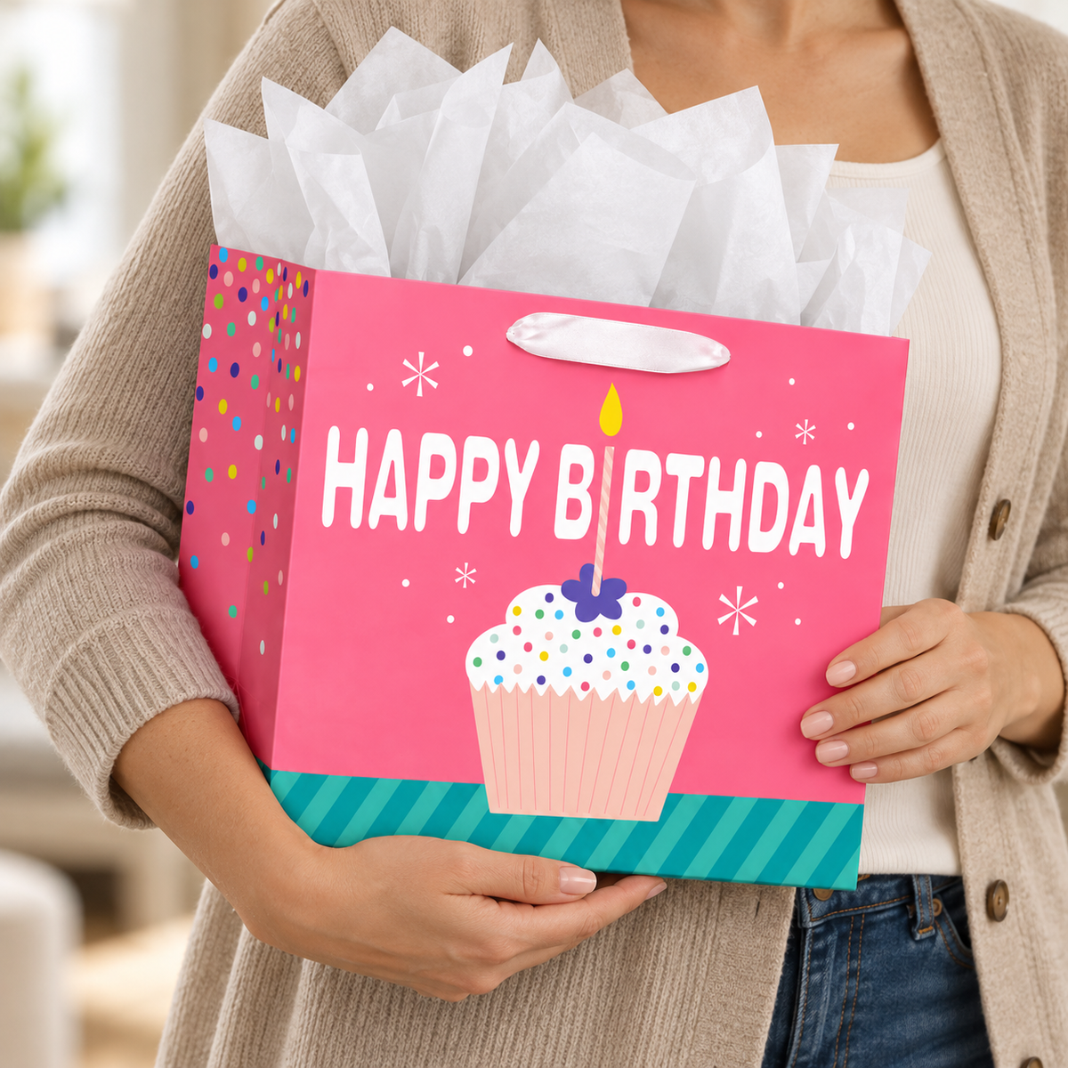 Pink Cupcake Birthday Gift Bag with Card and Tissue carried by an adult