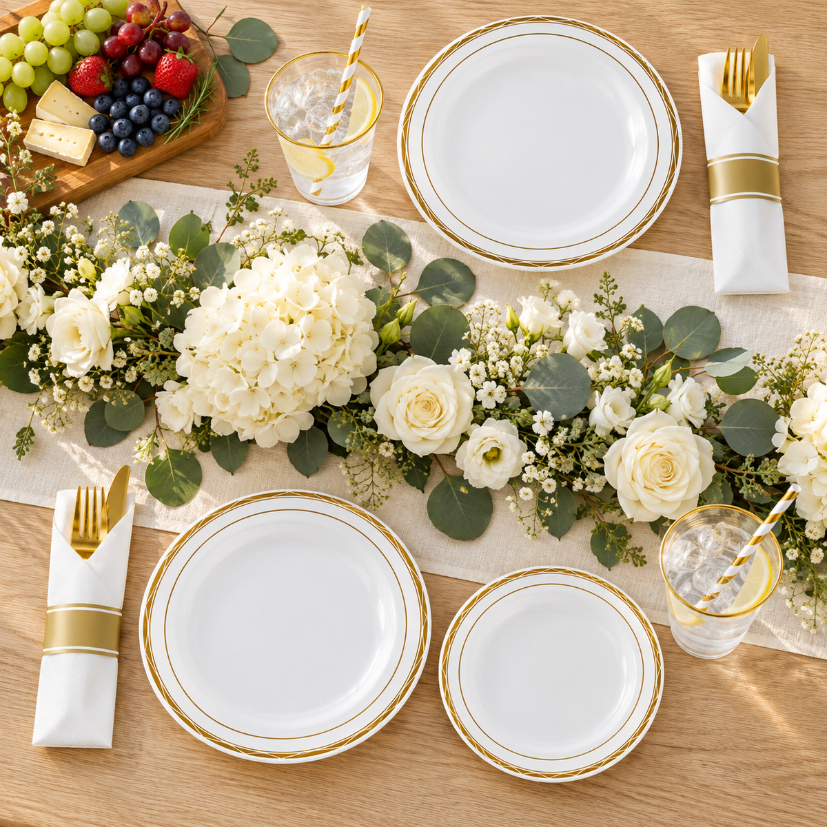 Overhead view of white and gold diamond-rimmed party dinnerware. Food, flowers and extra decor are styling props, not included.