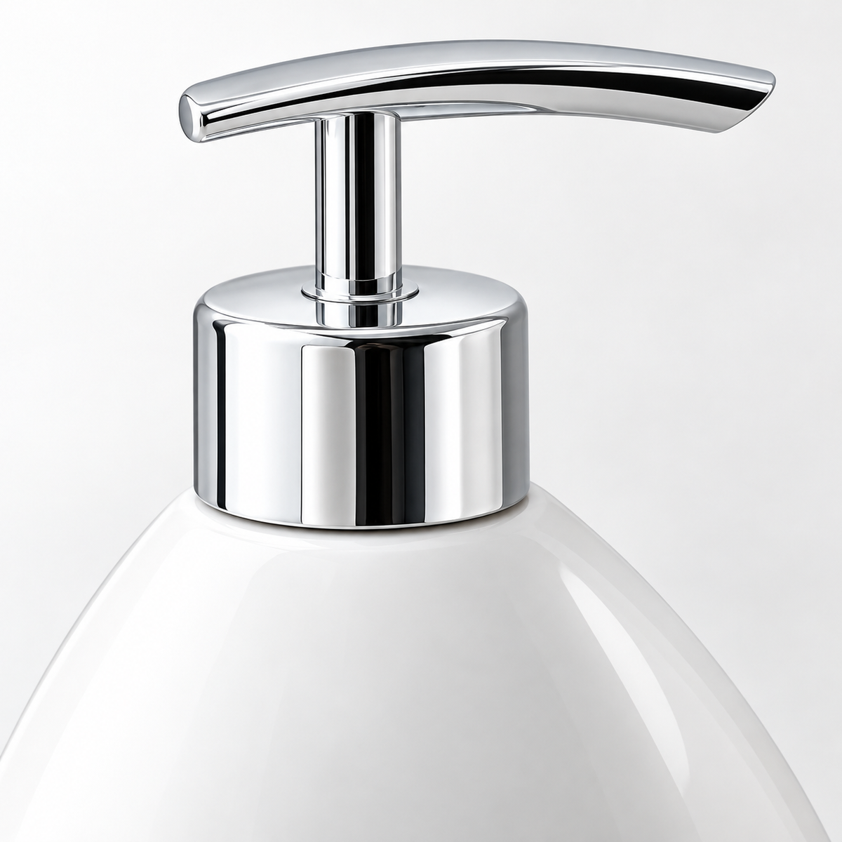 Chrome soap pump and white porcelain bottle shoulder close-up