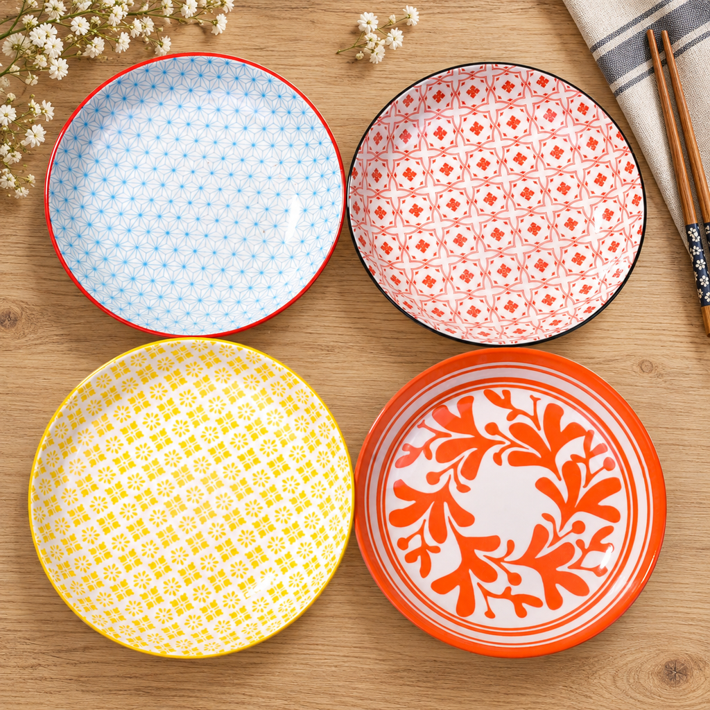 Overhead view of the four Japanese-style patterned appetizer plates. Food, linens and additional styling accessories are not included.