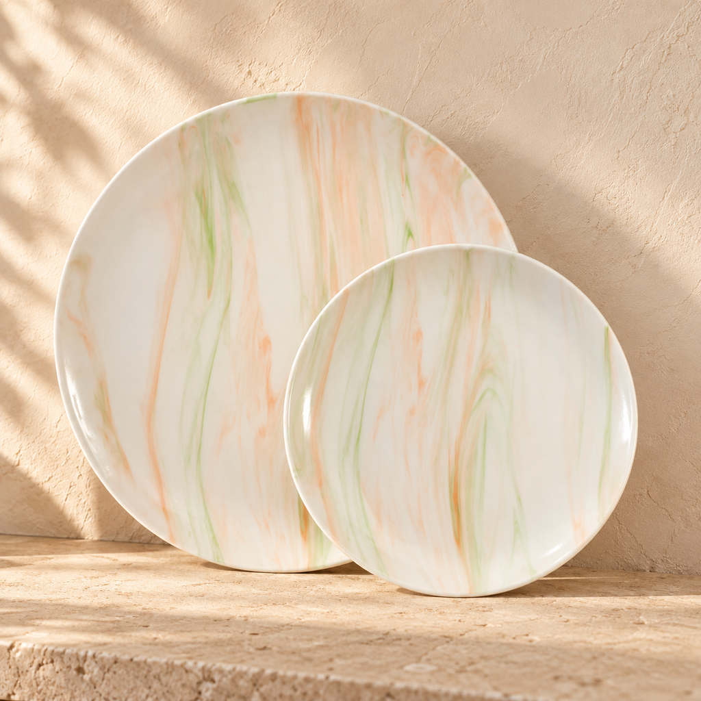 Dinner and salad plates showing pale orange and green marble patterns