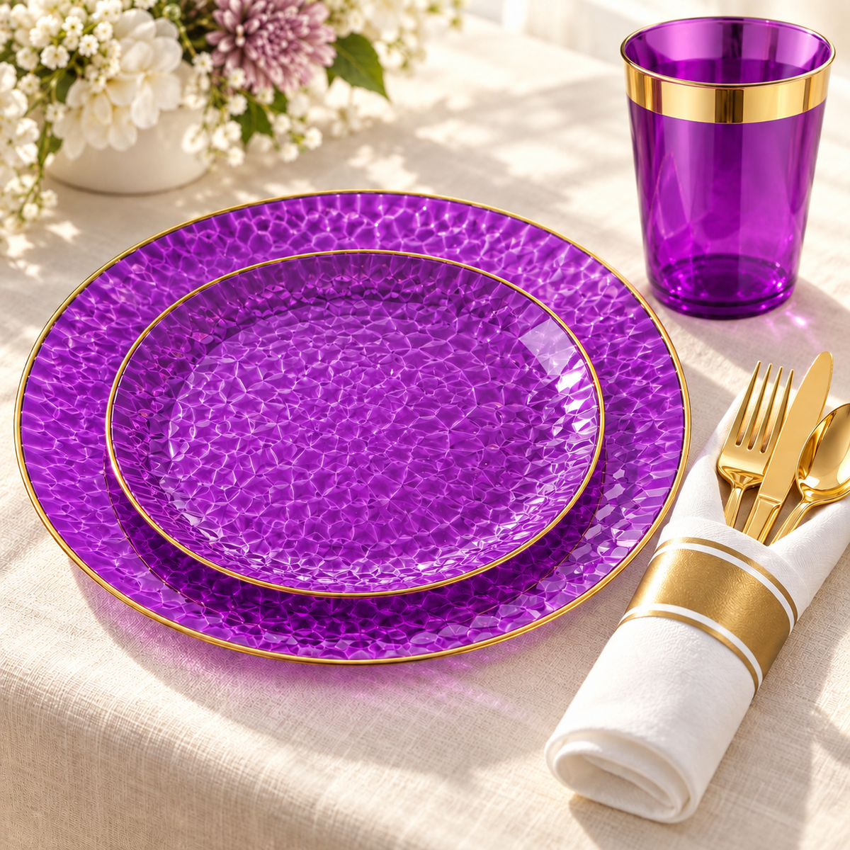 Purple and Gold Hammered Plastic Dinnerware Set, 175 pc in a styled product photograph. Food, flowers and extra decor are styling props, not included.