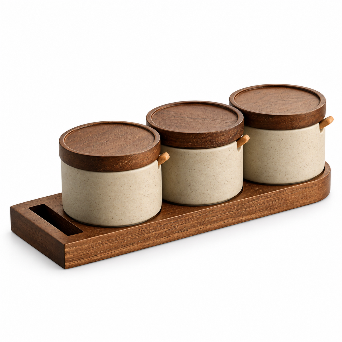 Three ceramic seasoning jars with wooden lids spoons and tray on white background