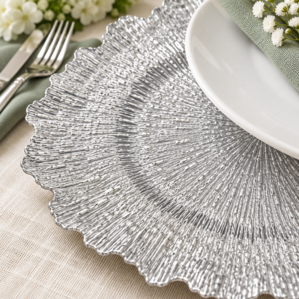 Silver Ruffled Charger Plates, 100 pc in a styled product photograph. Dinner plates, food, flowers and extra decor are styling props, not included.