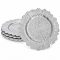 Silver ruffled charger with fine radial texture and an irregular scalloped perimeter. Representative arrangement on white, not the full pack quantity.