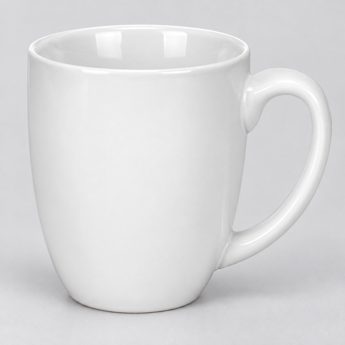 Close view of the white mug rounded rim and large oval handle