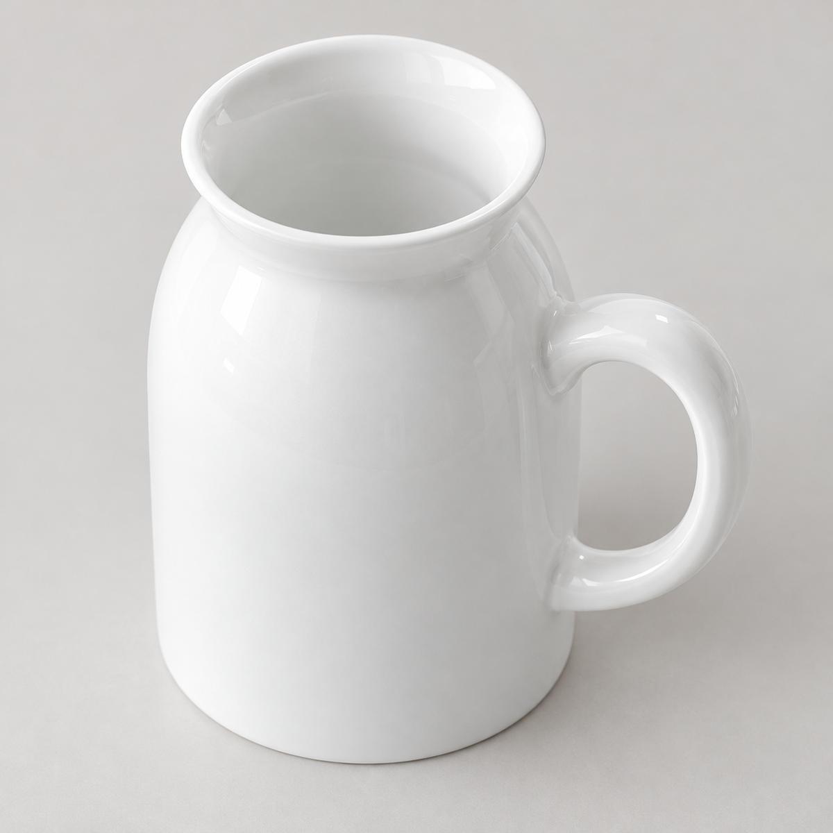 White porcelain vase viewed from above showing its interior and handle