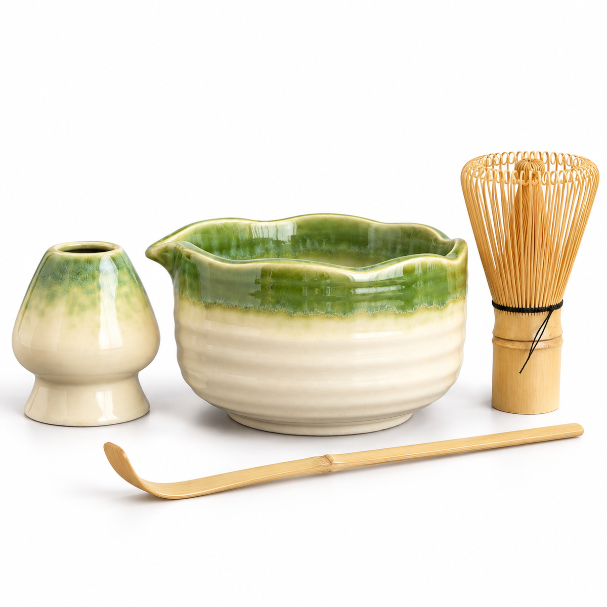 Four-piece green and ivory matcha set with scalloped bowl, holder, bamboo whisk and scoop