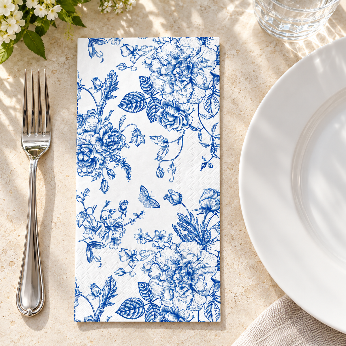 Blue Wildflower Paper Guest Napkins, 100 pc - overhead table view. Styling props not included.
