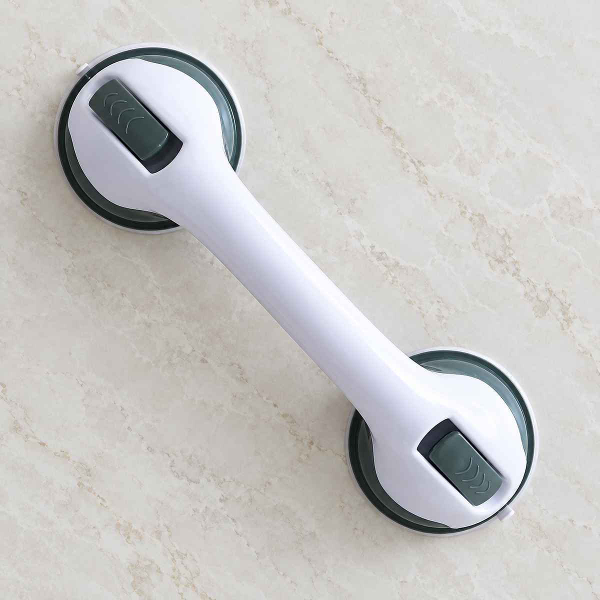 One off-white suction grab handle mounted diagonally on smooth panel; unloaded static display