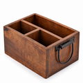 Empty dark brown three-compartment wooden caddy with visible black loop handle on white
