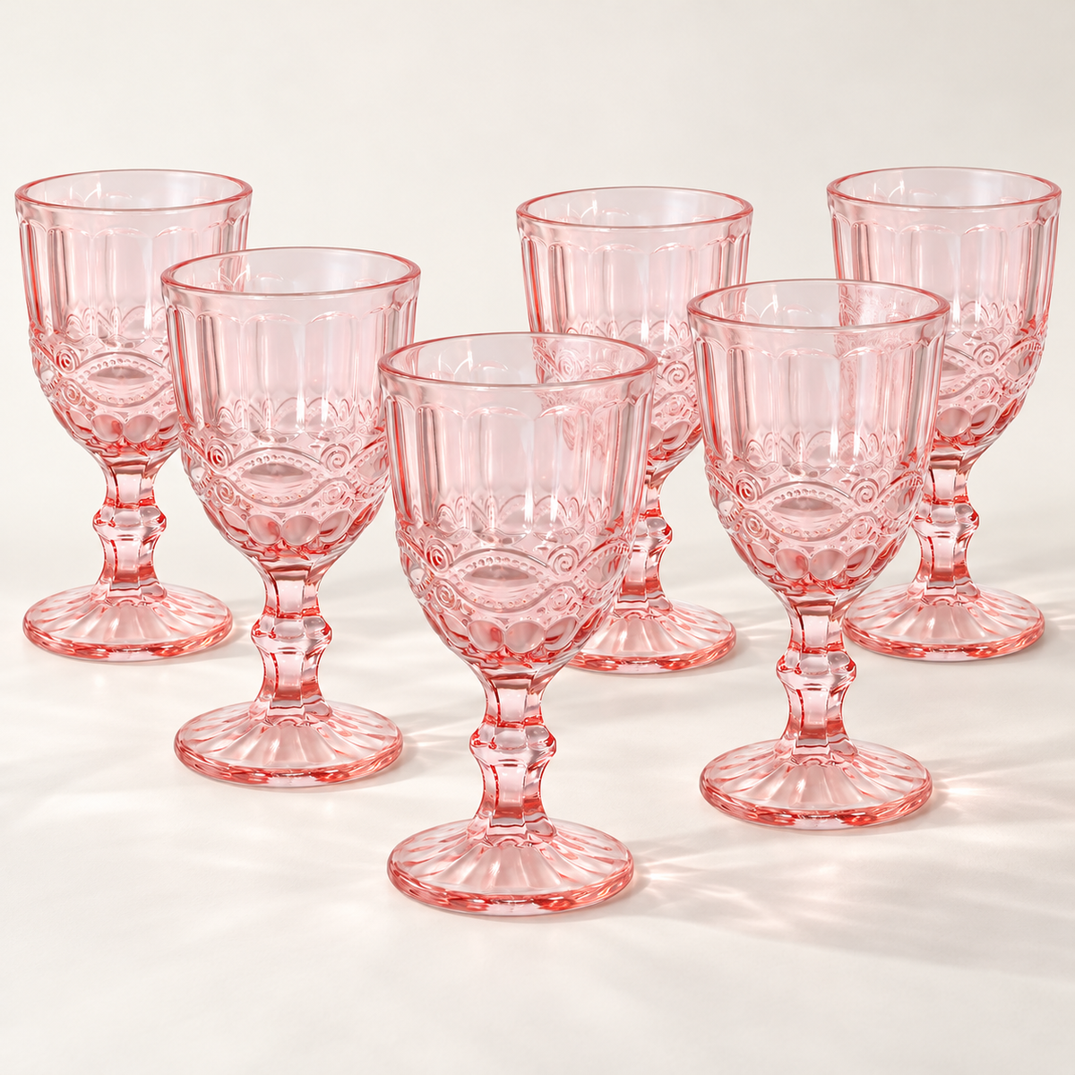 Pink pressed-glass goblets: set of six