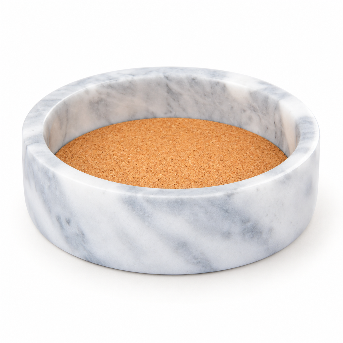 Empty white marble coaster with inset cork, showing the rim and shallow interior.