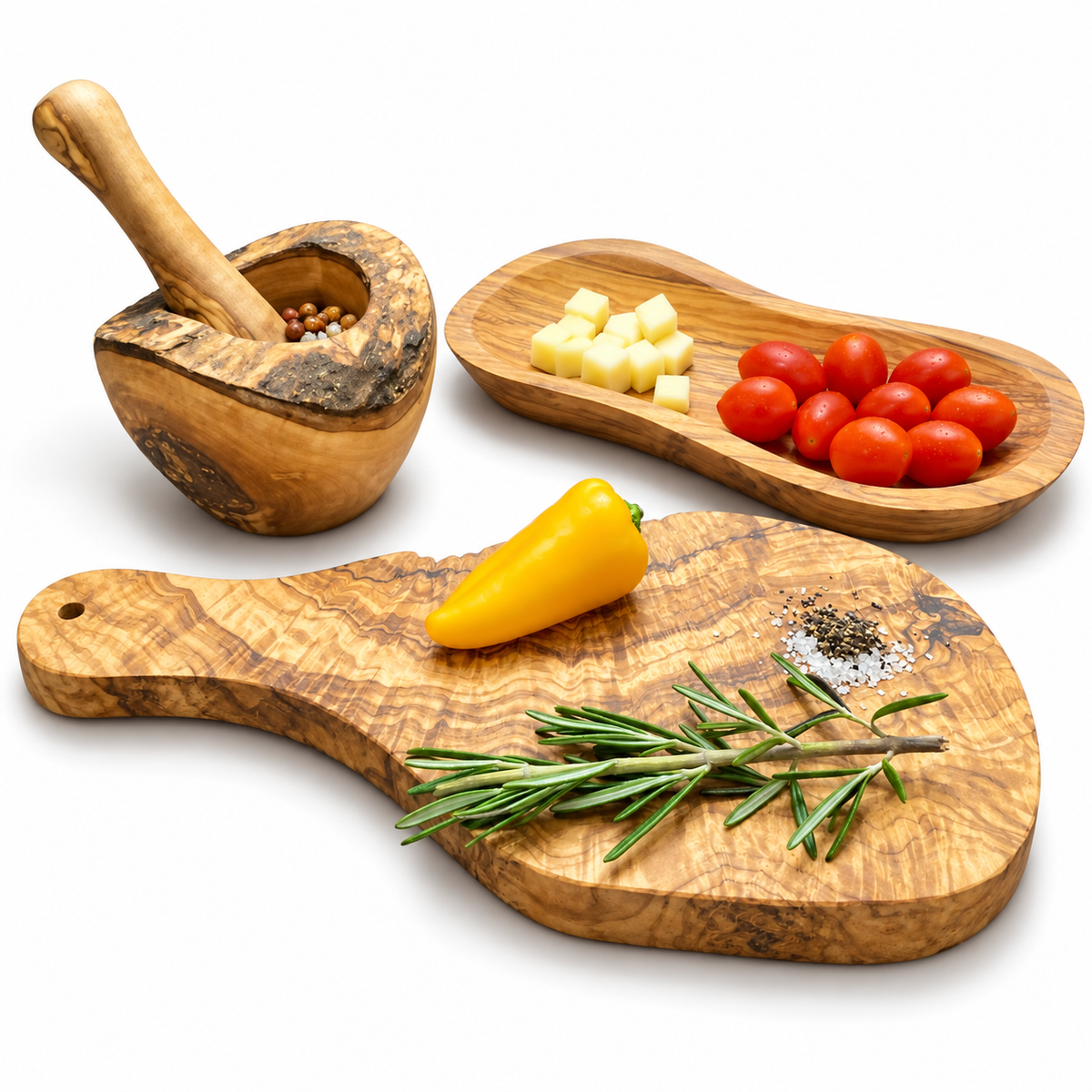 Handled natural-edge wood board, elongated bowl, natural-edge mortar and pestle on white. Food, herbs and spices are styling props, not included.