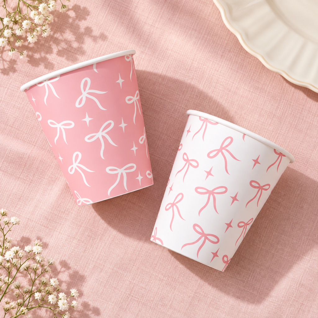 Pink and white bow paper cups - overhead product view