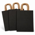 Representative folded black kraft gift bags with natural twisted-paper handles on white; selling unit is 200 bags.