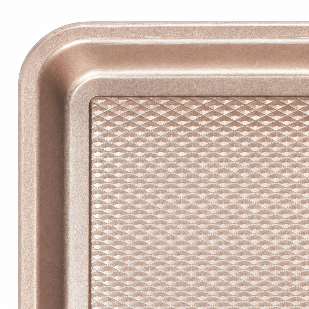 Gold baking pan rounded rim and diamond-pattern detail