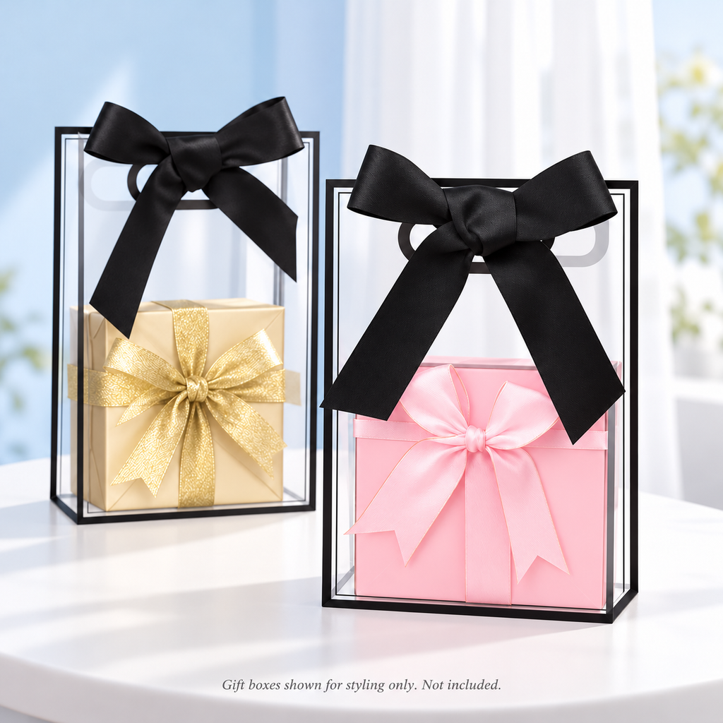 Two clear black-edged gift bags with styled gift boxes; contents not included