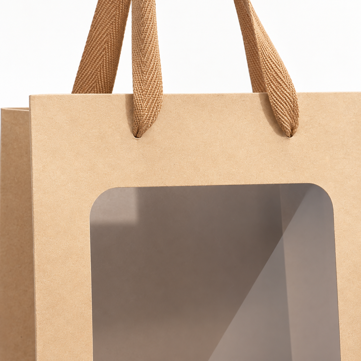 Close-up of the brown fabric handles and clear front window