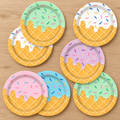 Representative pastel ice-cream print paper plates in five colors arranged on an oak table