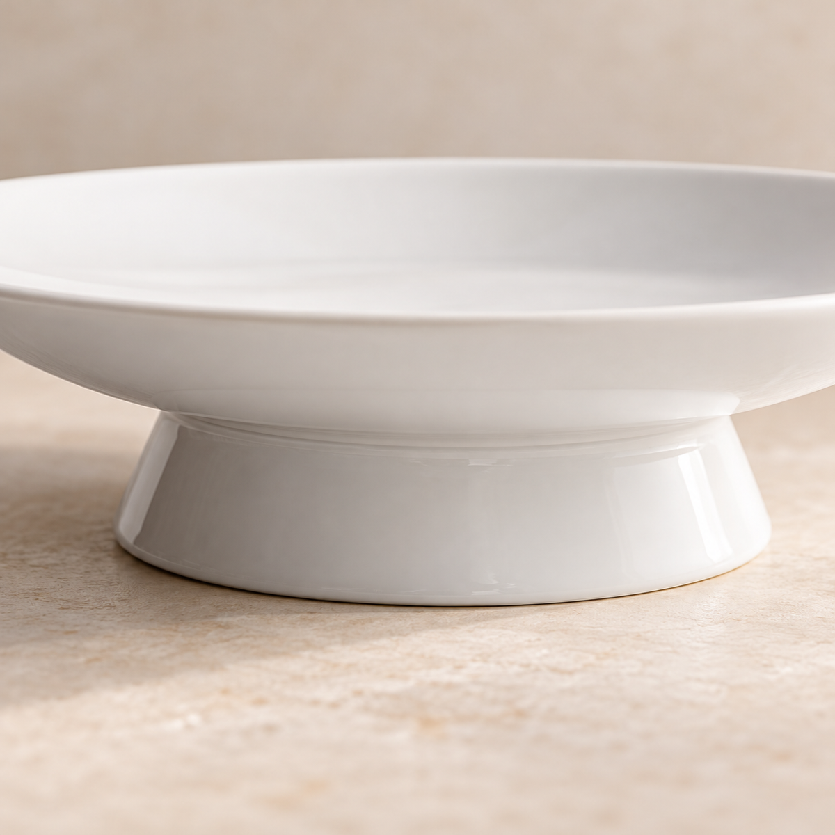 Low-angle close detail of broad ceramic pedestal foot