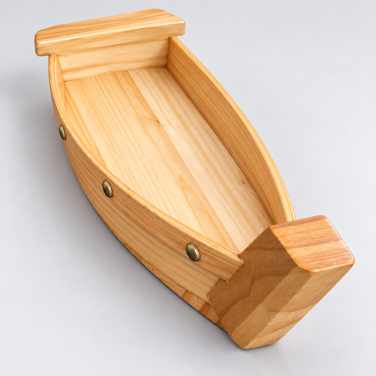 Pine sushi serving boat empty interior and wood grain, lengthwise view