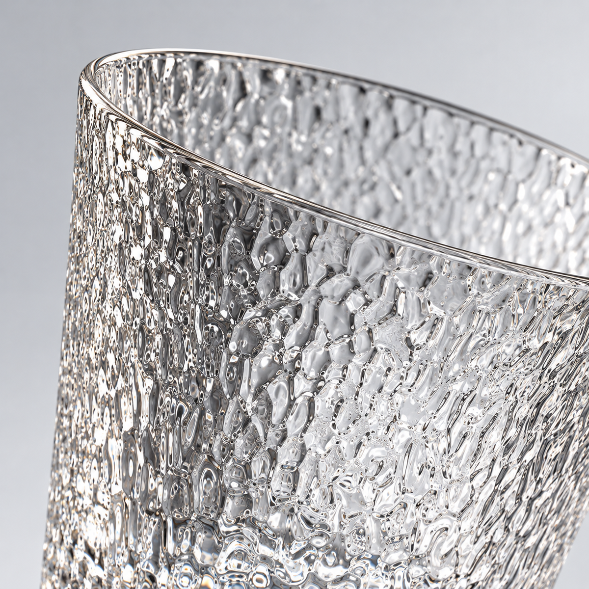 Brina whiskey glass rim and textured wall close-up
