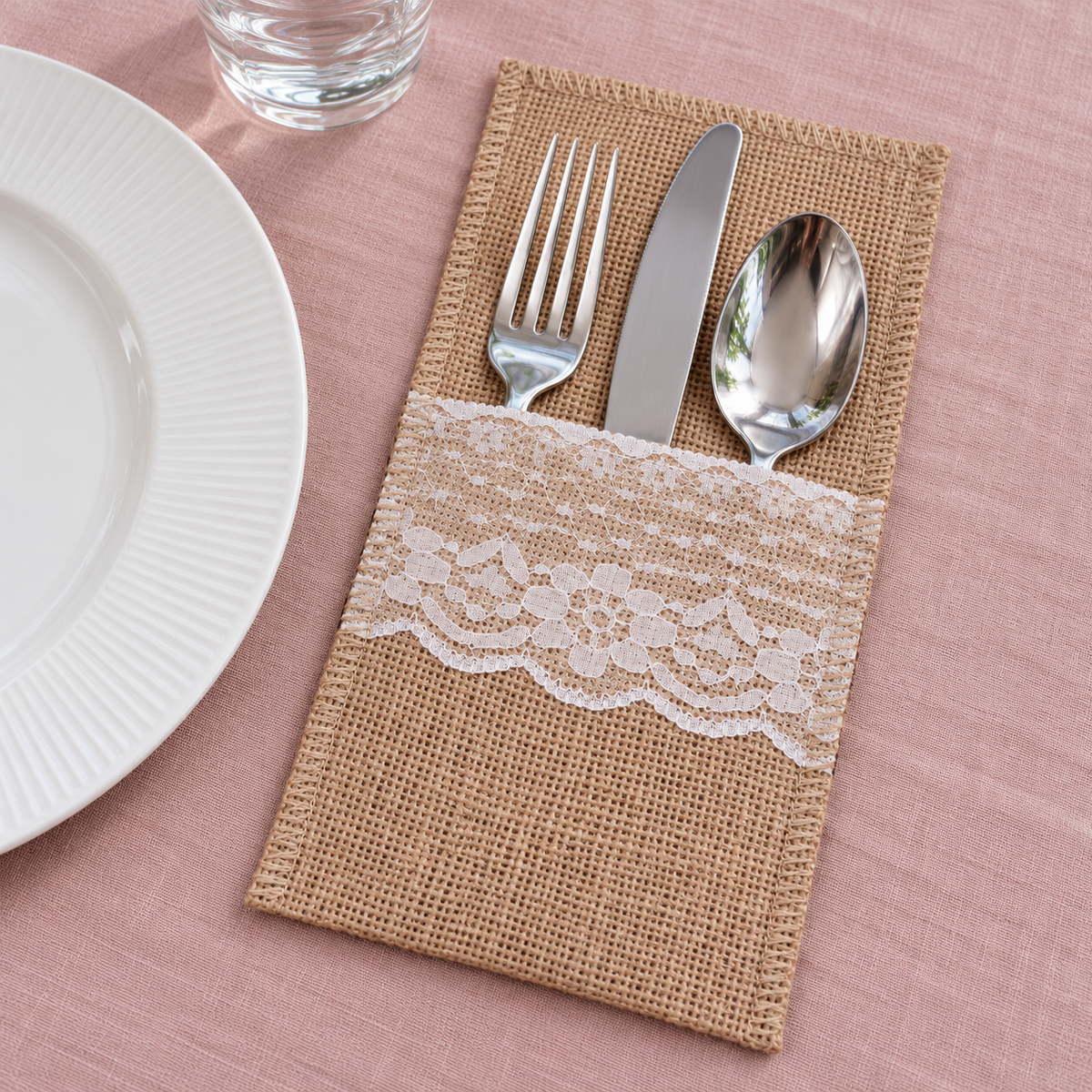 Style A pouch with a broad floral front trim, styled with cutlery. Cutlery, tableware and decor are not included.