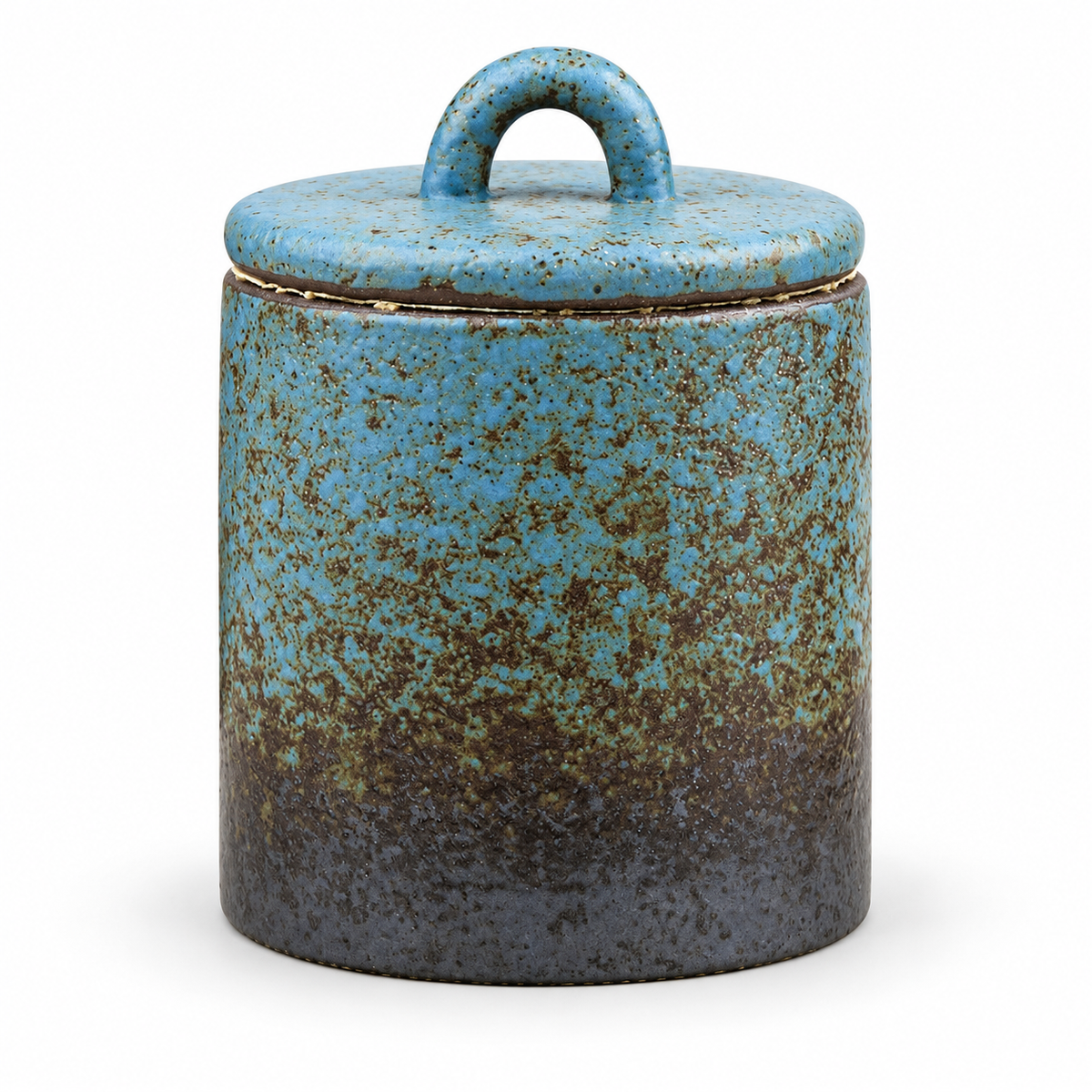 Blue mottled ceramic tea canister on white