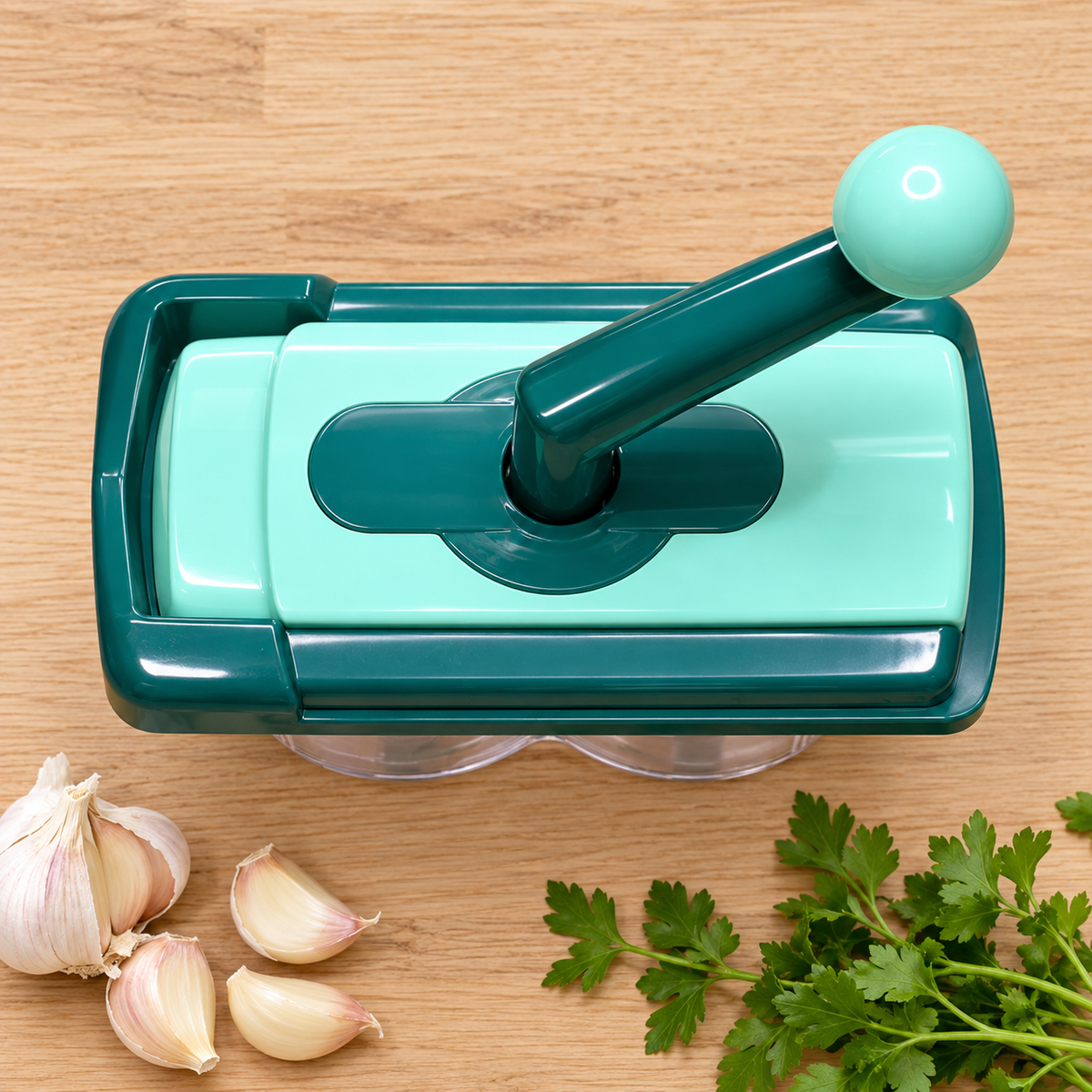 Green hand-crank vegetable chopper, overhead