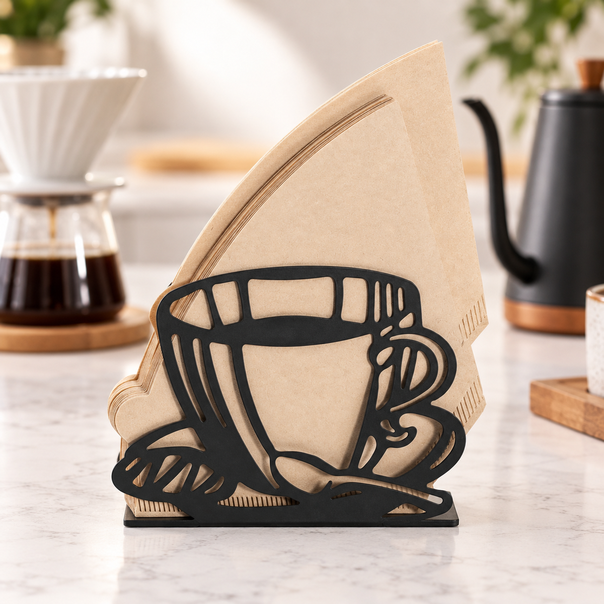 Front view of the black coffee filter holder on a coffee counter; filters and brewing equipment are props